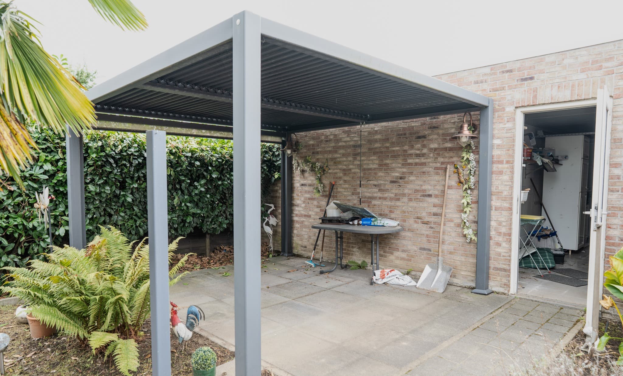 Gelijkvloers 2-slpk appartement met tuin + 2 garageboxen